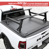 White truck with a black tonneau cover, featuring aluminum and adjustable properties.