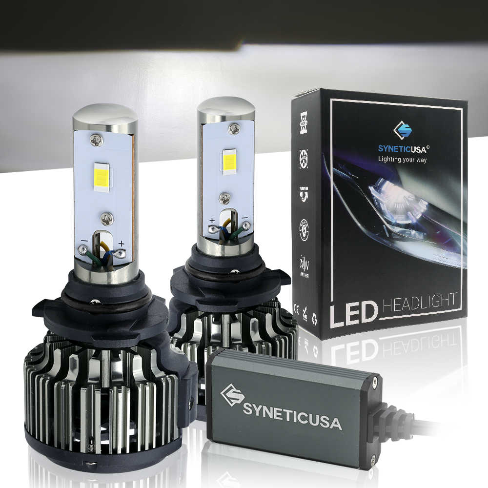 Two LED 9006 headlight bulbs and their packaging with Synetic USA branding on a reflective surface.