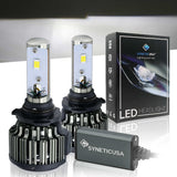 Two LED 9006 headlight bulbs and their packaging with Synetic USA branding on a reflective surface.