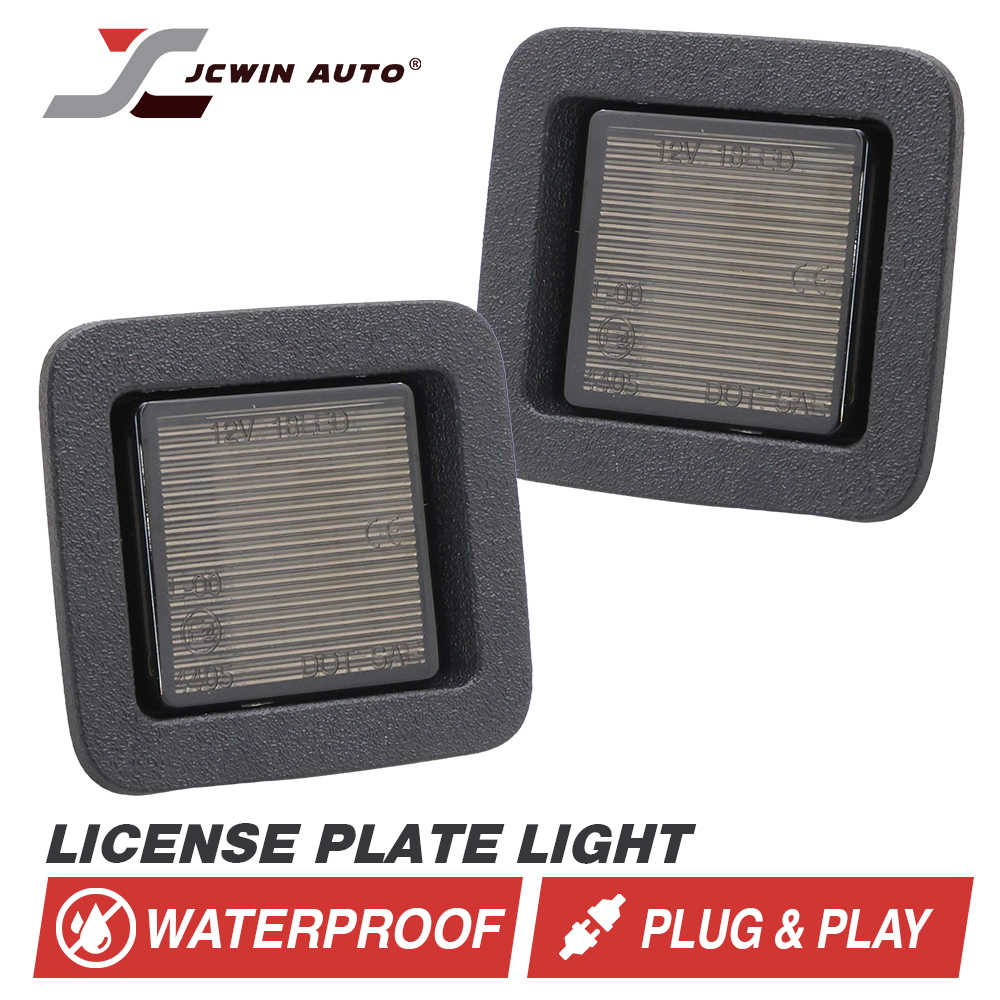 Two license plate lights with JCWin Auto branding on a white background
