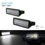 Two black rectangular LED license plate light bars shown on a white background, with text reading 'RAM 1500 2019 - 2026', 'LED x16', a white light effect preview, and a dark car-mounted view showing illumination.
