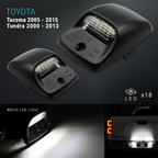 Two black Toyota truck bed LED light pods for Tacoma 2005-2015 and Tundra 2000-2013, shown on a dark background with text indicating white LED light output and compatibility.