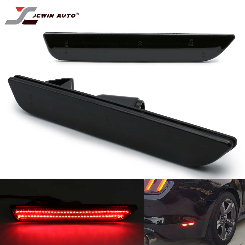 Black glossy rear bumper backup camera light strip by JCWIN AUTO, shown in three views: top-down, angled, and illuminated red on a car rear bumper.