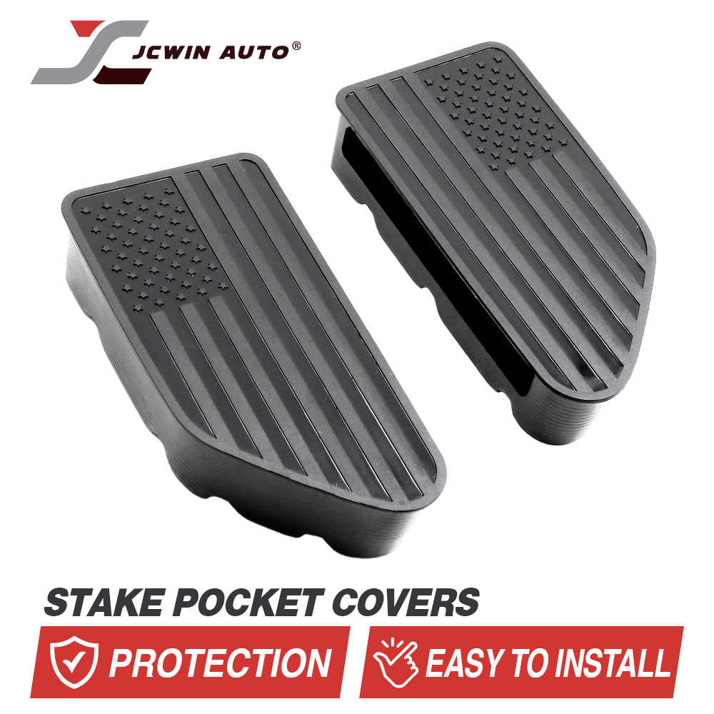 A pair of black foot pedal covers with a raised American flag design, shown on a white background with the brand name JCWIN AUTO and text reading 'STAKE POCKET COVERS' and 'PROTECTION EASY TO INSTALL'.
