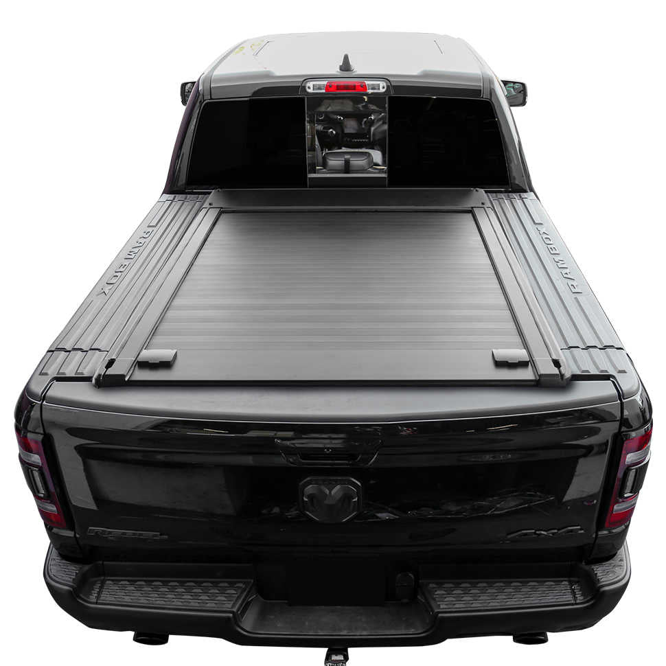 Black truck with a tonneau cover on a white background