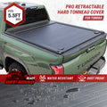 Green Toyota Tundra truck with a Pro Retractable Hard Tonno Cover on a white background