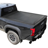 Black truck with a tonneau cover on a white background