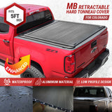 emb retractable tonneau cover installed on red Chevy Colorado 5ft bed branding JCWIN