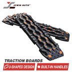 Black U-shaped traction boards with built-in handles and orange grips for off-road vehicle recovery