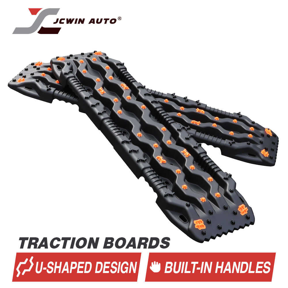 Black U-shaped traction boards with built-in handles and orange grips for off-road vehicle recovery