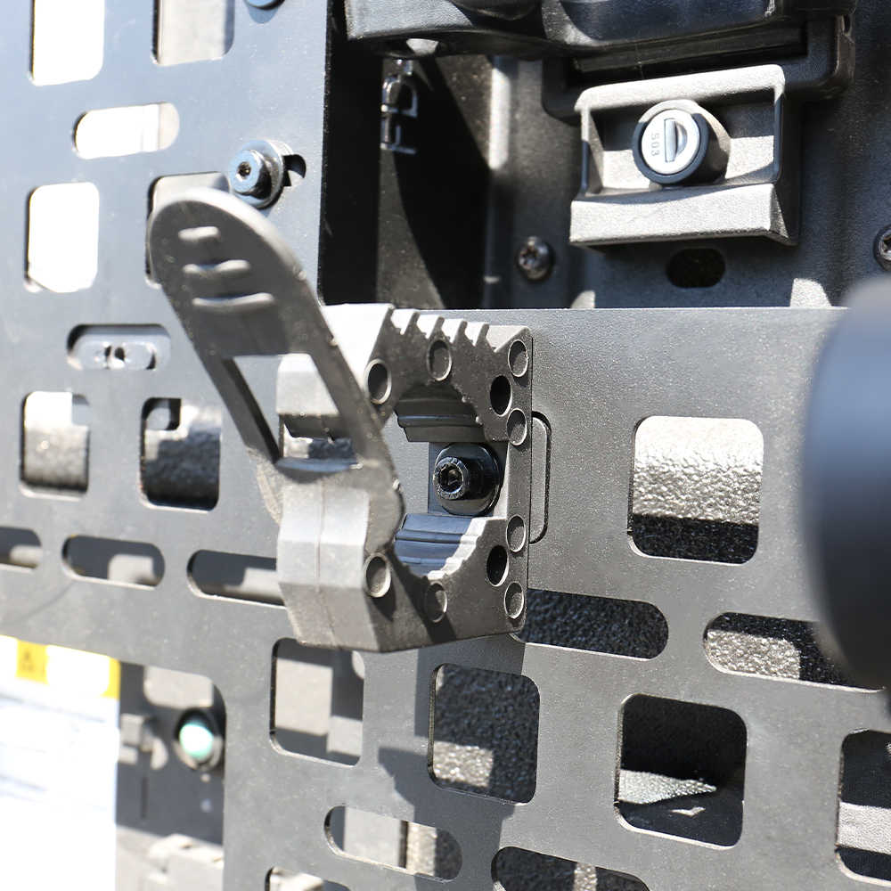 Close-up of a metal bracket with screws and a textured surface