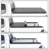 Collapsible truck bed cover shown in three stages of deployment on a white truck.