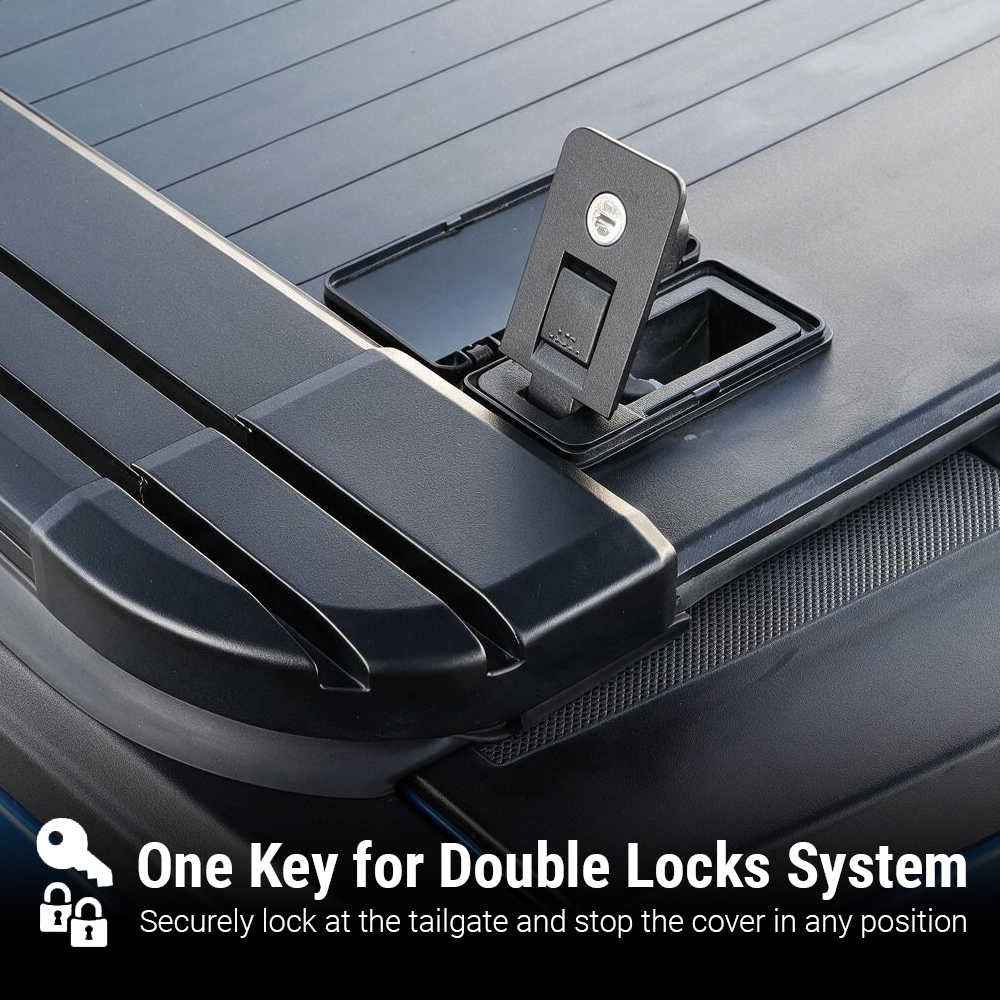 Close-up of a black hardcover tailgate cover with a latch mechanism and a small lock cover on top. White text at the bottom reads 'One Key for Double Locks System' with a key icon, explaining the lock feature.
