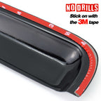 Black car spoiler with red 3M tape on a white background