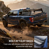 Blue truck with built-in T-slot rails on a mountain road