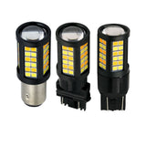 Three car light bulbs with visible LED chips on a white background