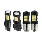 Four black LED car light bulbs with multiple yellow-white chips, shown from different angles on a plain white background.