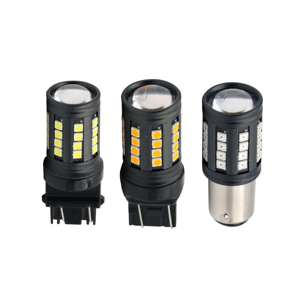 Three black LED car light bulbs with yellow and white illuminated chips, shown on a plain white background. One bulb on the right has a silver metal base.