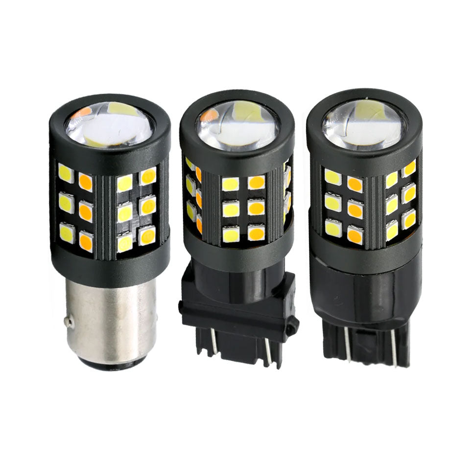 Three LED light bulbs with different base types on a white background