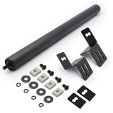 Set of mechanical components including a large black roller and various smaller parts on a white background