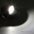 A close-up of a small black LED light emitting a bright white beam of light, with the text 'WHITE LED LIGHT' in the bottom right corner.