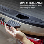 A hand holding a black snap-in step pad next to a beige truck bed, with text reading 'SNAP-IN INSTALLATION' and 'Installs in seconds with a secure, no-drill snap-in design.'.