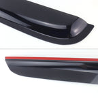 Black car spoiler with red accent on a white background