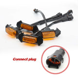 Set of automotive indicator lights with a close-up of a connect plug on a white background.