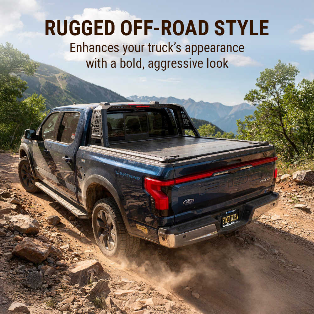 Black truck on a rugged off-road path with mountains in the background