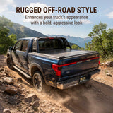 Black truck on a rugged off-road path with mountains in the background