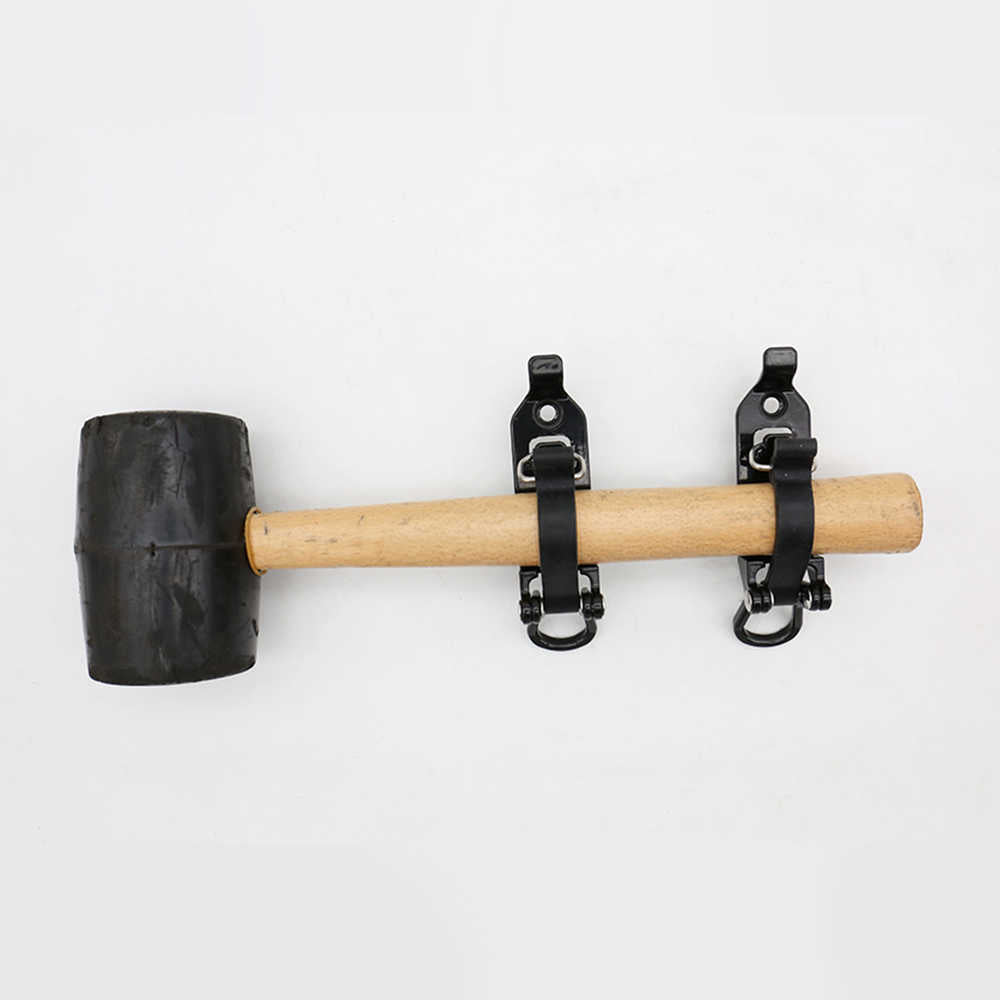 A wall-mounted rubber mallet hammer with a black rubber head, natural wood handle, and two black metal wall brackets, shown against a plain white background.