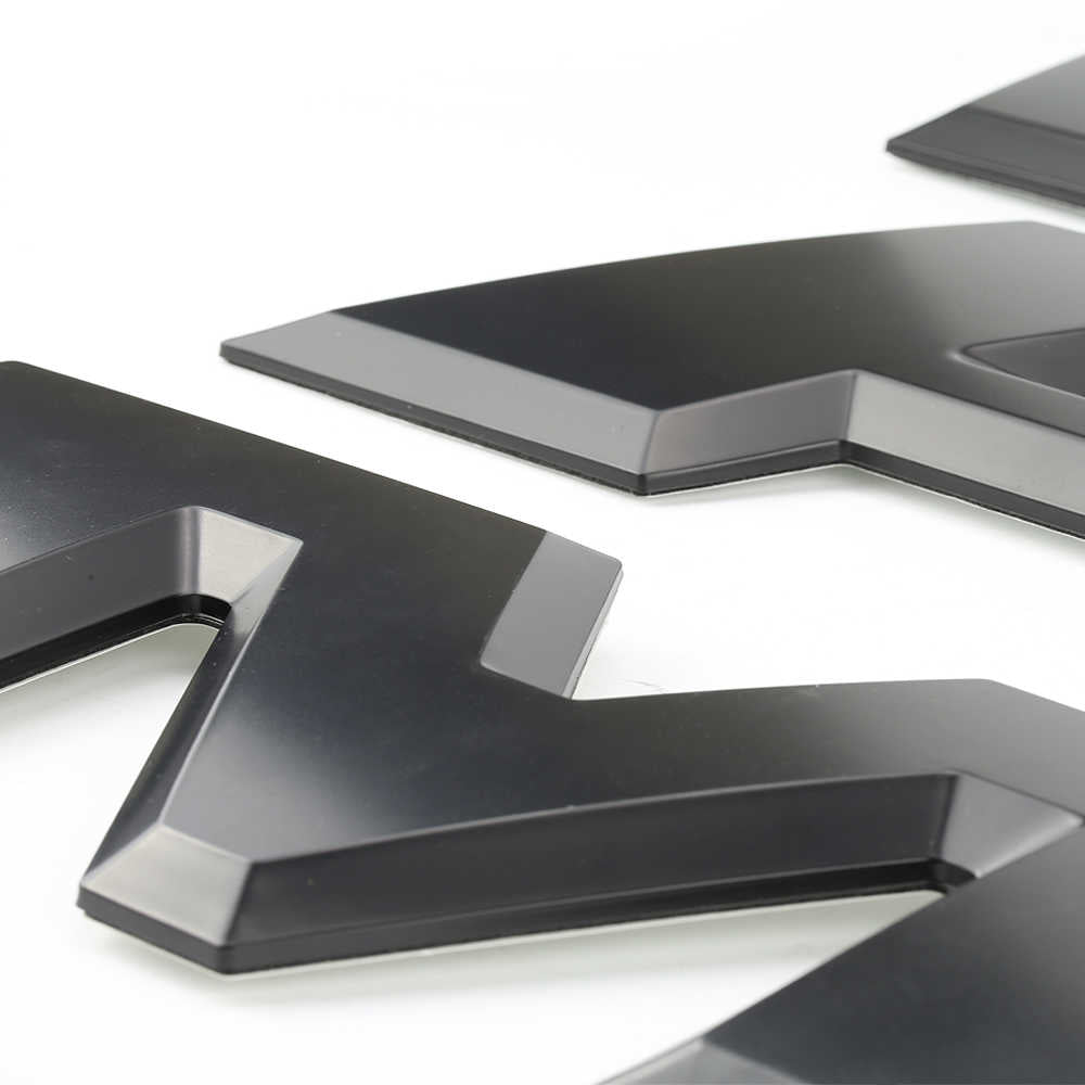 Black 3D automotive emblem with sleek design for truck customization