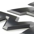 Black 3D automotive emblem with sleek design for truck customization