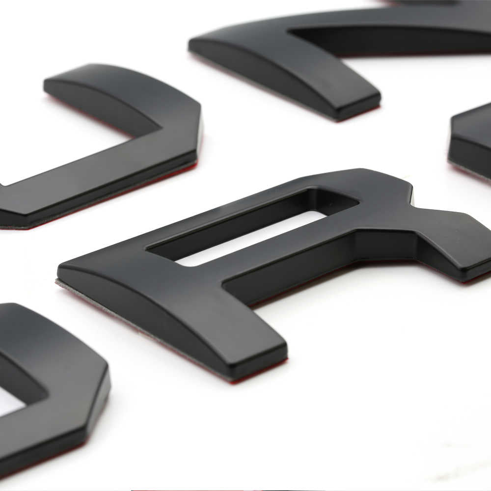 Black 3D car emblem letters for truck customization and styling