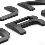 Black 3D car emblem letters for truck customization and styling
