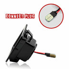 A black circular electronic plug or connector with red and black wires, shown on a white background with a circular inset highlighting the plug tip and the text 'CONNECT PLUG'.