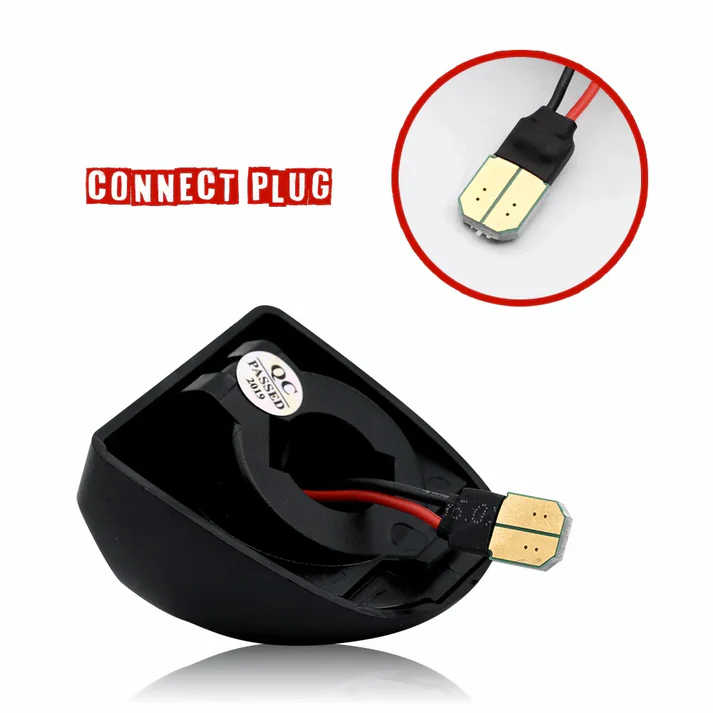 Black plastic connector plug with red and black wires and gold metal contacts, shown on a white background with a circular inset close-up of the plug and the text 'CONNECT PLUG'.