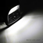 Close-up of a white LED light bulb on a dark background.