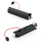 Two black plastic laser pointer alignment caps with red wires and connectors, shown on a white background.