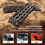 Black off-road recovery boards with orange grips for mud, snow, sand traction