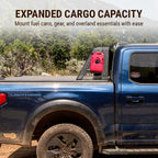 Blue truck with a red fuel can mounted on a holder, set against a natural landscape.