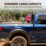 Blue truck with a red fuel can mounted on a holder, set against a natural landscape.