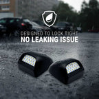 Two black waterproof LED light bars shown on wet pavement in the rain, with overlaid text reading 'DESIGNED TO LOCK TIGHT' and 'NO LEAKING ISSUE' plus a shield icon.