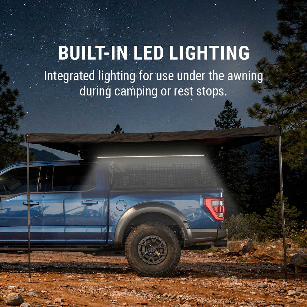 Blue truck with a built-in LED lighting system for camping under an awning.