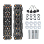 Black textured truck bed mats with orange accents and mounting hardware for trucks