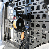 Close-up of a mechanical device attached to a textured metal surface