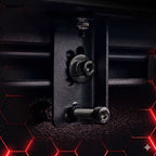 Close-up of a mechanical component with bolts on a dark background
