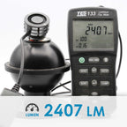 Luminous flux meter with digital display showing 2407 Lumen on a white background