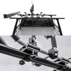 Top-down view of a black roof rack system mounted over a vehicle bed, with a close-up detail shot of the mounting hardware and springs below on a white background.