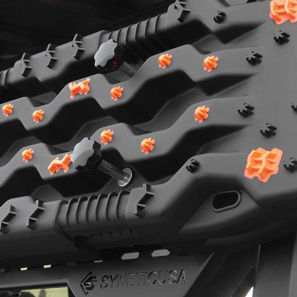 Black textured truck bed mat with orange and black fasteners, compatible with Trucks